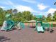 Community playground includes a climbing wall, slides, and other engaging play equipment, offering children active recreation at 804 Cambridge Hall Loop, Apex, NC 27539