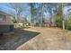 Spacious backyard features mature trees, open grassy space, and partial fencing at 818 Eastern Ave, Rocky Mount, NC 27801