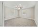 Bright bedroom features neutral walls, plush carpet, ceiling fan and windows offering natural light at 818 Eastern Ave, Rocky Mount, NC 27801