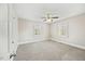Bedroom featuring neutral walls, carpet, baseboard trim and two windows at 818 Eastern Ave, Rocky Mount, NC 27801