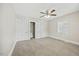 Bedroom features new carpet, closet, neutral paint, and a ceiling fan at 818 Eastern Ave, Rocky Mount, NC 27801
