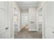 Hallway view with multiple doorways and neutral carpeting, leading to other rooms in the home at 818 Eastern Ave, Rocky Mount, NC 27801