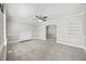 Open living room offers fireplace, neutral paint, windows and seamless access to other living spaces at 818 Eastern Ave, Rocky Mount, NC 27801