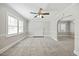 Bright living room features neutral paint, fireplace, large windows and new carpet at 818 Eastern Ave, Rocky Mount, NC 27801