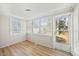 Bright sunroom features wood floors, natural light, and an exterior door at 818 Eastern Ave, Rocky Mount, NC 27801