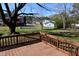 Backyard view from deck features trees and other neighborhood homes at 107 Ware Ct, Garner, NC 27529