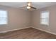 Bright bedroom featuring neutral paint, hardwood floors, and a ceiling fan at 107 Ware Ct, Garner, NC 27529