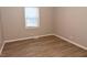 Cozy bedroom with neutral walls and wood-look floors providing a comfortable atmosphere at 107 Ware Ct, Garner, NC 27529