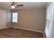 Bright bedroom features natural light from two large windows and neutral color palette at 107 Ware Ct, Garner, NC 27529