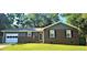 Charming single-story home with brick accents, well-maintained lawn, and attached garage at 107 Ware Ct, Garner, NC 27529