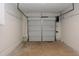 Spacious garage with overhead door offering ample storage and parking space at 107 Ware Ct, Garner, NC 27529