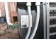 Close-up of a home's outdoor HVAC unit showing the label and electrical connections at 107 Ware Ct, Garner, NC 27529