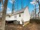 View of the house from the backyard with a patio at 1100 Walter Clark Dr, Hillsborough, NC 27278
