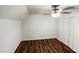 Bedroom features spacious closet, hardwood floor, and modern ceiling fan at 1100 Walter Clark Dr, Hillsborough, NC 27278