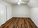 Bedroom featuring spacious closet, hardwood floor, and modern ceiling fan at 1100 Walter Clark Dr, Hillsborough, NC 27278