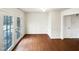 Bright living room featuring hardwood floors and glass patio doors at 1100 Walter Clark Dr, Hillsborough, NC 27278