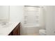 Bathroom with single sink vanity, medicine cabinet, and a shower-tub combination at 116 Polaris Ave, Garner, NC 27529