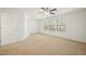 Bedroom with carpet, ceiling fan, and windows providing ample natural lighting at 116 Polaris Ave, Garner, NC 27529
