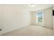 Well-lit bedroom featuring neutral walls, carpet, and a window with blinds for privacy at 116 Polaris Ave, Garner, NC 27529