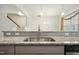 Modern kitchen featuring granite countertops, stainless steel sink, and contemporary pendant lighting at 116 Polaris Ave, Garner, NC 27529