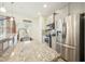 Well-lit kitchen boasting stainless steel appliances, granite countertops, and ample cabinet space for storage at 116 Polaris Ave, Garner, NC 27529