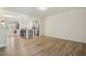 Spacious living room featuring modern flooring, an open floorplan, and a large window allowing lots of light at 116 Polaris Ave, Garner, NC 27529