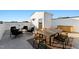 Rooftop deck with seating and dining area at 1218 Coach Station Alley # 201, Raleigh, NC 27601