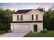 Charming two-story home with a two-car garage and manicured lawn surrounded by lush trees at 125 Ferry Ct, Rocky Mount, NC 27804