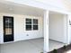 Inviting front porch with black front door and visible house number at 136 Tee Time Ter, Benson, NC 27504