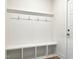 Convenient mudroom with built-in bench, cubbies, and coat hooks at 136 Tee Time Ter, Benson, NC 27504