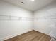 Spacious walk-in closet with ample shelving and a clean, organized layout at 136 Tee Time Ter, Benson, NC 27504