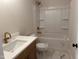 Bathroom features a shower and tub combination with modern fixtures at 141 Noramac Ct, Selma, NC 27576