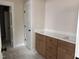 Bathroom featuring double sinks, quartz countertop, and modern fixtures at 141 Noramac Ct, Selma, NC 27576