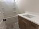 Bathroom featuring tub, quartz countertop, and modern fixtures at 141 Noramac Ct, Selma, NC 27576