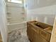 Bright bathroom with a new tub and vanity, ready for finishing touches at 141 Noramac Ct, Selma, NC 27576