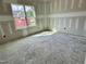 Bedroom with large windows provide an unobstructed view and ample sunlight for an inviting space at 141 Noramac Ct, Selma, NC 27576