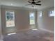 Bright bedroom with large windows and a ceiling fan fixture at 141 Noramac Ct, Selma, NC 27576