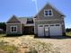 Charming new construction home boasts modern design and a two-car garage at 141 Noramac Ct, Selma, NC 27576