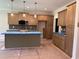 A modern kitchen with an island, stainless steel appliances, and pendant lighting at 141 Noramac Ct, Selma, NC 27576