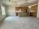 Spacious unfinished kitchen with new cabinets and island offers functional storage, perfect for cooking at 141 Noramac Ct, Selma, NC 27576