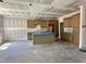A kitchen with ample cabinets and a central island under construction at 141 Noramac Ct, Selma, NC 27576
