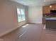 Spacious kitchen view with modern finishes and natural light from the window at 141 Noramac Ct, Selma, NC 27576