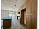A kitchen with cabinets, a center island, and plenty of natural light at 141 Noramac Ct, Selma, NC 27576