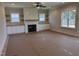 Cozy living room with a modern fireplace, custom built-ins, and large windows at 141 Noramac Ct, Selma, NC 27576
