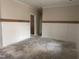 Living room with paneled walls and decorative wood trim for a modern farmhouse feel at 141 Noramac Ct, Selma, NC 27576