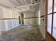 A spacious living room featuring paneled wainscoting and a modern, open design at 141 Noramac Ct, Selma, NC 27576