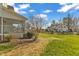 Side view of the backyard showing the deck and lawn at 154 Ashton Ln, Angier, NC 27501
