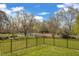Fenced backyard with lake view and well-maintained lawn at 154 Ashton Ln, Angier, NC 27501