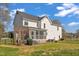 Exterior view of the home with a large, well-maintained backyard at 154 Ashton Ln, Angier, NC 27501