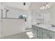 Bathroom featuring double sinks, white subway tile shower, and a large window at 154 Ashton Ln, Angier, NC 27501